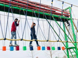 Zip Line, Sky Bike, Artificial Wall Climbing, Zorbing Roller, Running Bungee, Swimming Pool, Rain Dance, Pottery, Shooting, Archery, Multi Activity Net, Commando Net, Adventure Bridges, Cricket Ground, Volleyball Court, Basketball Court, Badminton Court, Football Ground, Table Tennis etc. All of these activities are included in the package at Rajwada Farms - An Ethinic Village, Sports, Picnic Ground & Adventure Park in Faridabad, one of the best adventure park in Delhi NCR